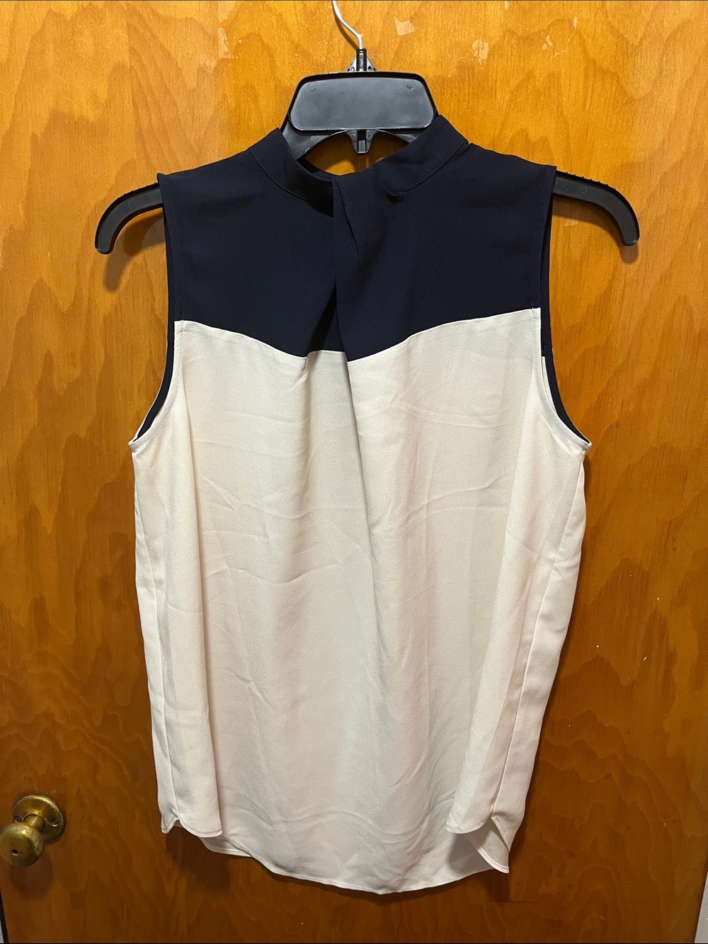 Sleeveless Two-Tone Mock Neck Top in Navy and Cream